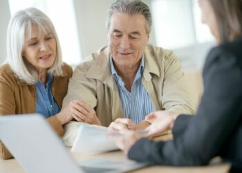 Older Elderly Couple looking over paperwork