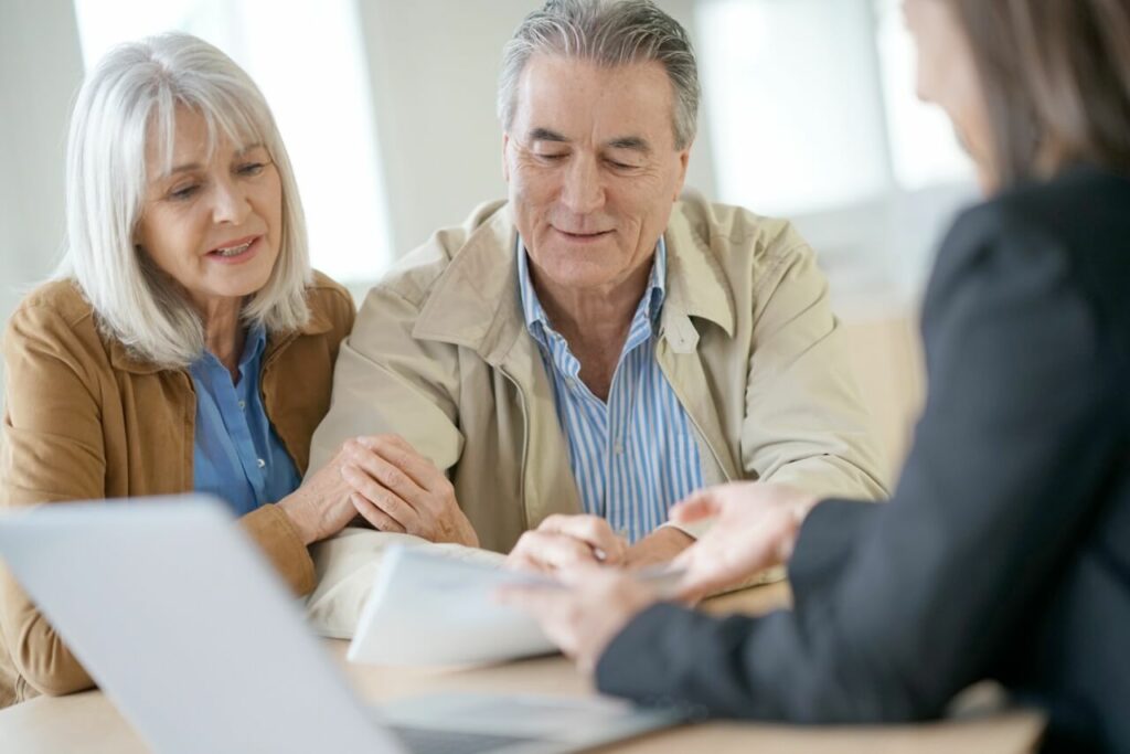 Older Elderly Couple looking over paperwork